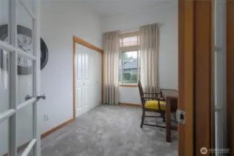 Third bedroom with glass doors.  Would make the perfect office or TV room.