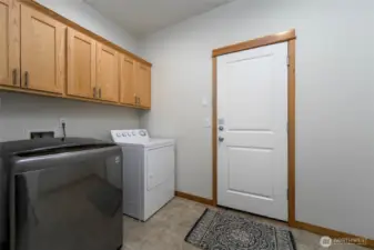 Laundry room that leads to the two car garage.