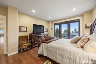 The large primary bedroom also takes in the stunning bay views and has three doors (one is operable) that have remote-controlled blackout shades.