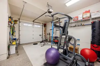 One bay of the garage has been used as a work-out area.