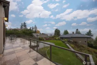 Looking toward the south over the additional parking and the homes below, with the bay and San Juan Island views beyond.