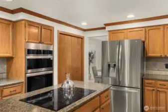 Kitchen features granite counters and stainless steel appliances