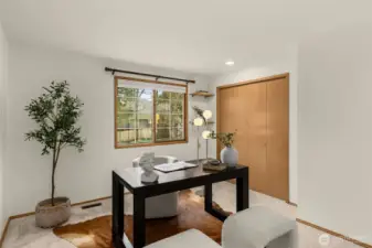 1 of 5 spacious bedrooms, which is currently staged as an office