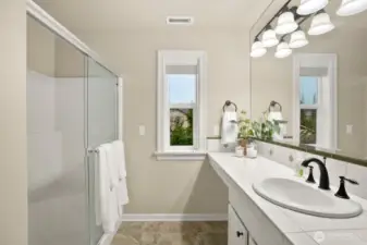 Primary bathroom with walk-in shower plus linen closet-this home has it all!