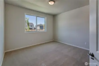 Photos are taken of a Shelby plan previously built in the community.