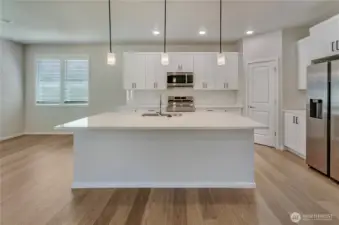 Photos are taken of a Shelby plan previously built in the community.