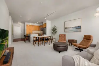 The open living and dining area feels bright and welcoming, with an easy flow that makes everyday living and entertaining feel effortless. Note: This image has some AI generated staging.