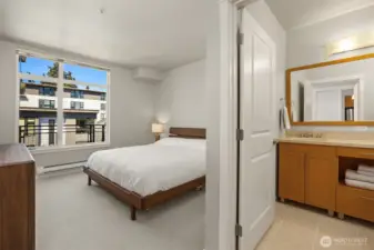 A generous primary suite includes a walk-in closet and full en-suite bath.
