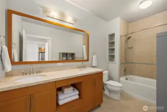 The full en-suite bath features generous counter space and classic finishes.