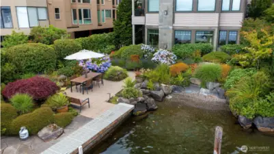 Your "Lock and Leave Lifestyle" awaits! Dine lakeside year-round at your privately shared waterfront. Wade in beach for your daily swim and paddleboarding.