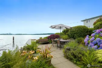 Moorage dock for small watercraft, wade-in swim beach, and a dining/gathering space for BBQs!