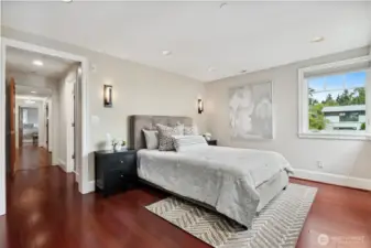 Primary bedroom is east-facing. Watch the sunrise over Downtown Bellevue, the Cascade Mountains, and the lake!