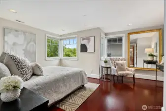 Lounge before bed, the alcove in the primary suite provides additional space for reading and quiet streaming.