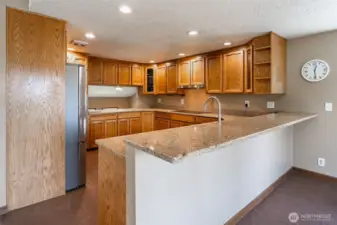 Open kitchen with granite countertops and great storage