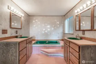 Open bathroom with dual sinks and large soaking tub!