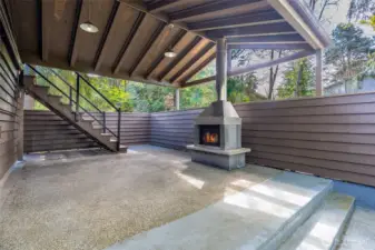 Covered deck with hot tub hookups and wood burning fireplace with lighting