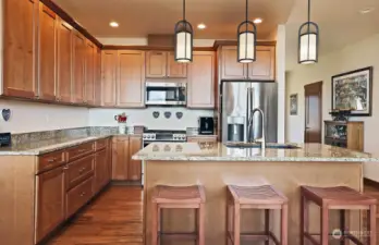 Quartz countertops, stainless appliances, and quality wood cabinets with soft close drawers.