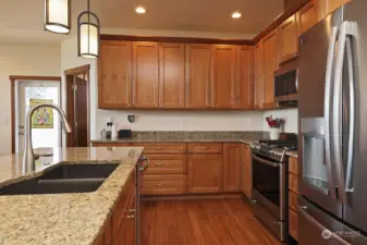 Six burner propane stove top with an electric oven. Your sink is positioned to take in your view. Clean stunning kitchen with lots of storage. The eucalyptus hardwood floors are gorgeous!
