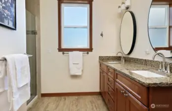 Spacious with double sinks, generous shower & walk-in closet.
