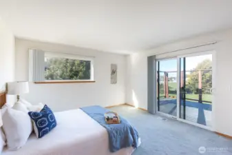 Primary Bedroom with access to the deck, and water views.