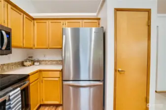 The pantry provides additional storage in this spacious kitchen.