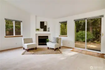 The family room provides many options for seating and relaxing. Notice the views of the private back yard where nature is sure to provide an idyllic respite to busy days.