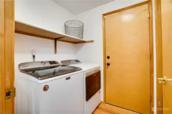 Just off of the garage, the laundry room serves as a mudroom too, with additional storage spaces. The washer and dryer are included!