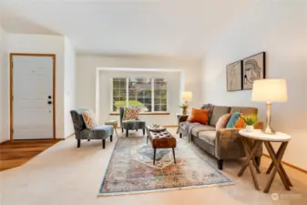 Step into a warm and inviting entryway featuring luxury vinyl flooring, perfect for welcoming guests on those rainy northwest days. Newly cleaned carpets and a vaulted ceiling add a fresh and airy feel to the home.