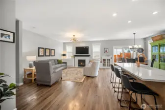 Warm and inviting living space with newer engineered hardwood flooring