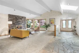 Expansive Living Room: A grand, open-concept space seamlessly connected to the welcoming entryway and stylish hallway wet bar, perfect for entertaining and comfortable everyday living.