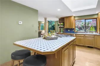 Versatile Eating Space: An island and bar area perfect for casual dining and socializing.