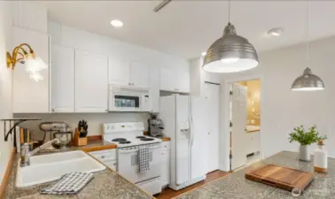 Virtually staged kitchen area. Plenty of granite tiled counter space for prep while you’re entertaining friends and family.