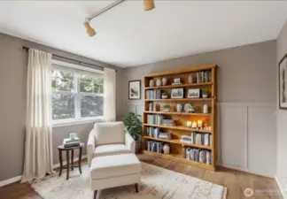 Virtually staged extra living area just off front door entry and the main living area. Could be used as a reading nook, office or TV/media room.