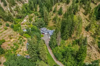 Set deep in the trees and wrapped in the quiet of canyon walls, this 20-acre Leavenworth retreat offers total privacy, endless potential, and a lifestyle rooted in nature - just minutes from town, yet a world away.