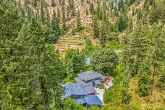 Set deep in the trees and wrapped in the quiet of canyon walls, this 20-acre Leavenworth retreat offers total privacy, endless potential, and a lifestyle rooted in nature - just minutes from town, yet a world away.