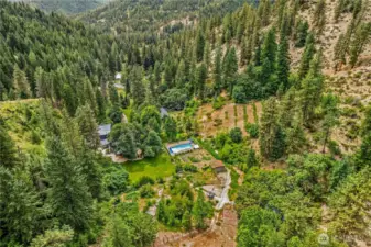 A true mountain sanctuary, with a vegetable garden, orchards, a pool, and forested hillside, offering the ultimate canvas for recreation, or simply living in rhythm with nature...truly a one of a kind property!