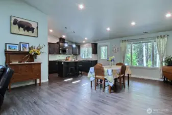 Kitchen and dining area look out to the private backyard, The back door leads to the covered back patio.