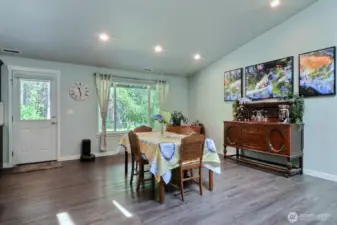 Entertain friends and family in the dining area. Looking out to the fruit trees and the acreage beyond.