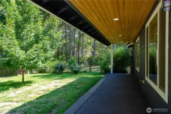 Covered back patio. Imagine a hot cup of coffee or tea back here in the morning ?