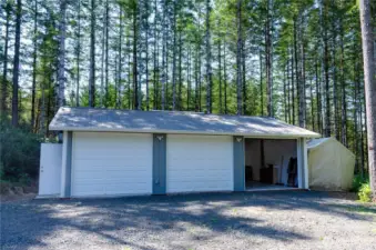 Detached Three car garage- Workshop, storage, 15-110 v electrical outlets, 220 v to supply box, 9 overhead fluorescent lights, pellet stove and is insulated.