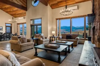 Walls of windows and welcoming space characterize this newly complete home