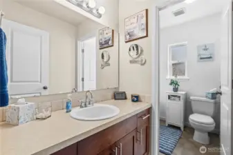 Spacious hall/guest bath with door separating shower/toilet from sink and counter!