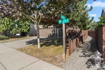 Right next to the trail to the playground