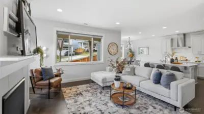 Natural light fills this spacious great room, creating the perfect setting for everyday living and entertaining.