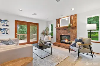 Enjoy winter evenings in front of the gas fireplace and open french doors in the summer to soak up the fresh summer evenings on the massive deck beyond.