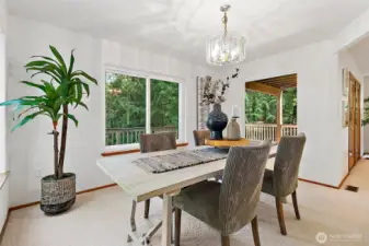 Dining windows look out onto the deck and  the views to the east