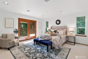 Upstairs is the large primary bedroom suite with its own deck to enjoy the ambiance surrounding this home.