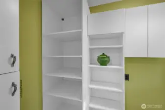 Additional pantry storage in hall behind the kitchen.