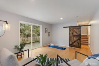 The barn door provides some privacy to this space. The slider provides access to the back patio and side yards.