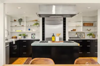 The cooking island divides the dining room and the kitchen.